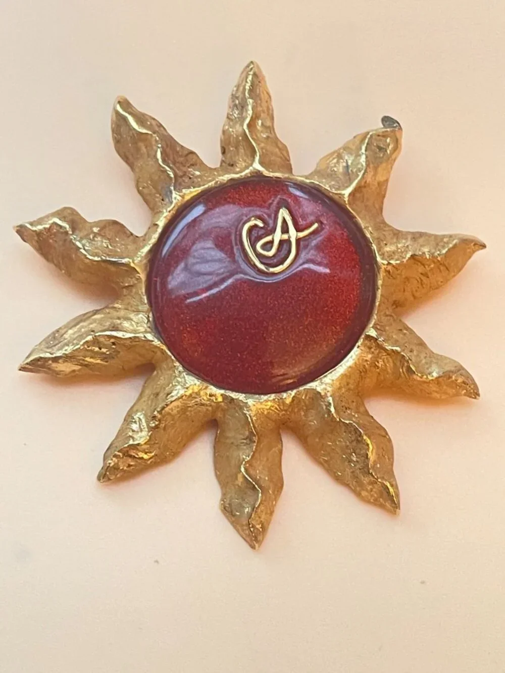 Christian Lacroix Gold-Tone Sun Brooch W/ Red Resin Center & Golden Logo